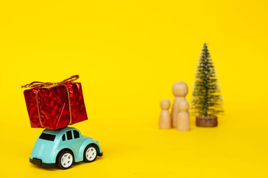 Mother, daughter, and son eagerly await their father return for Christmas with present.