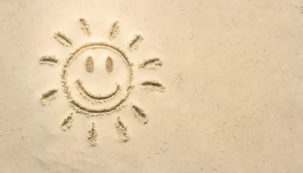 Background with sand in which a sun was painted with space for advertising or greetings.