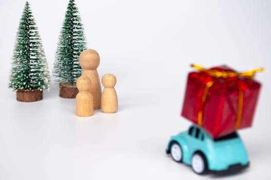 Mother, daughter, and son eagerly await their father return for Christmas with present.