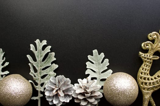 New Year's silver decorations on a black background with space for text