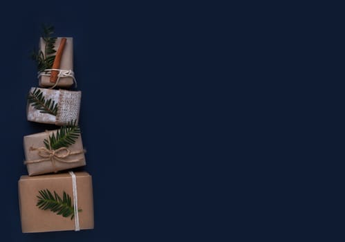 Boxes Different sizes with Christmas gifts on blue background flat lay ,top view ,free space for text.