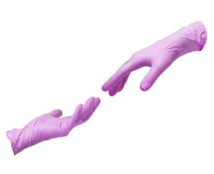 Two hands in sterile pink nitrile gloves reach out to each other. Skin protection during epidemics and quarantine. There is a place for text