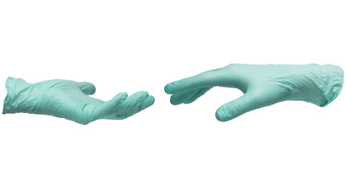 Two hands in sterile mint-colored nitrile gloves reach out to each other. Skin protection during epidemics and quarantine. There is a place for text. High quality photo