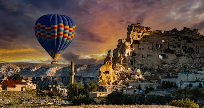 Hot air balloons near Cavusin in Goreme National Park in Cappadocia, Turkey.