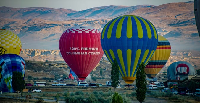 GOREME, TUR - OCT 14, 2023: Hot air balloons in Goreme National Park in Cappadocia, Turkey.