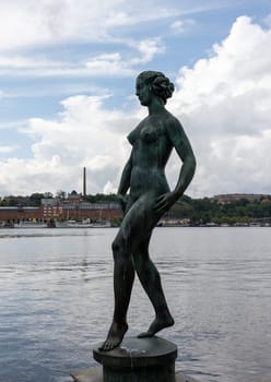 Stockholm, Sweden - July 25, 2023: The Dansen ( the dance ) statue sculpture in the gardens of the City Hall, Stadshuset of Stockholm. By Carl Eldh