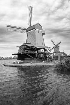 Black and white photo of Dutch windmills.  Zaanse Schans, Netherlands.