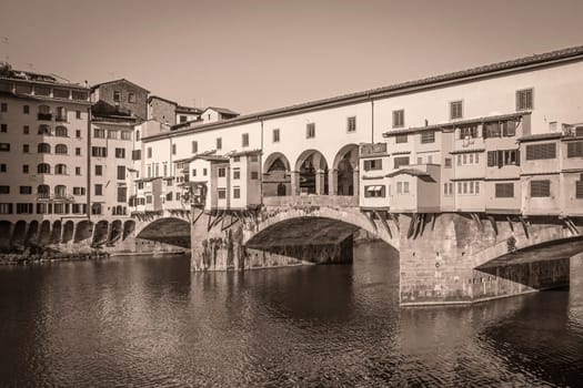 Ponte Vecchio Bridge in (Florence, Tuscany, Italy). Edited as a vintage photo. Horizontally.