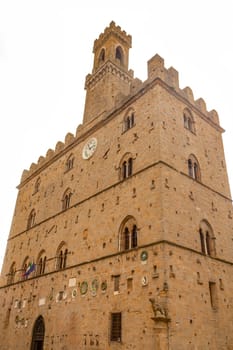 The Palace dei Priori is the most ancient palace in the Piazza dei Priori (Volterra, Tuscany, Italy).  On the white background.
