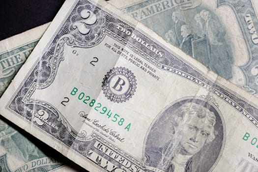 old crumpled banknotes denominated two U.S. dollars. High quality photo