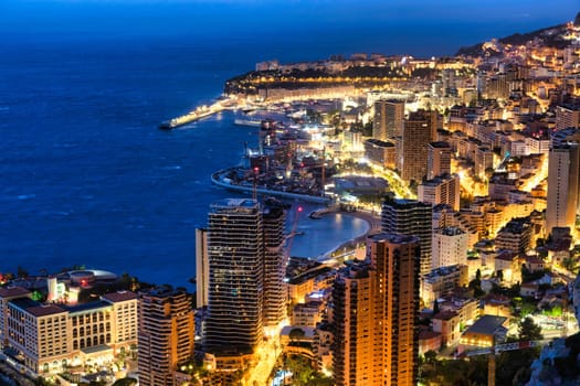 Monte Carlo panorama illuminated by night. Urban landscape with luxury architecture