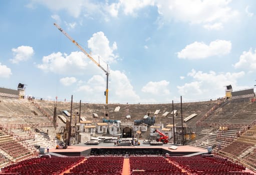 Verona, Italy - June 2022: workers preparing the stage for the thetre performance in the famous Arena