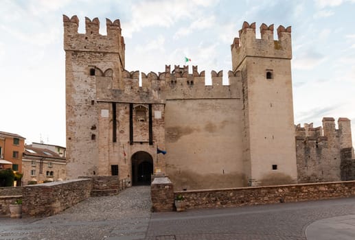 Sirmione, Italy - June 2022: Sirmione castle on Garda lake. Scenic mediaeval building on the water