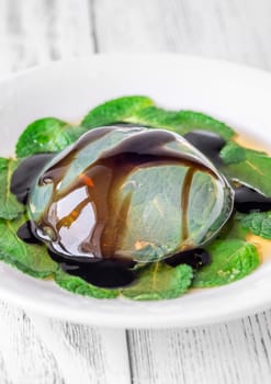 Portion of raindrop cake on mint leaves bad