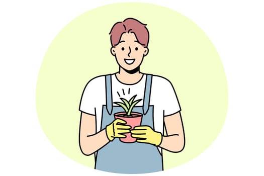 Smiling male in gloves and apron holding plant in pot. Happy gardener enjoy botanical floral hobby. Horticulture and gardening. Vector illustration.