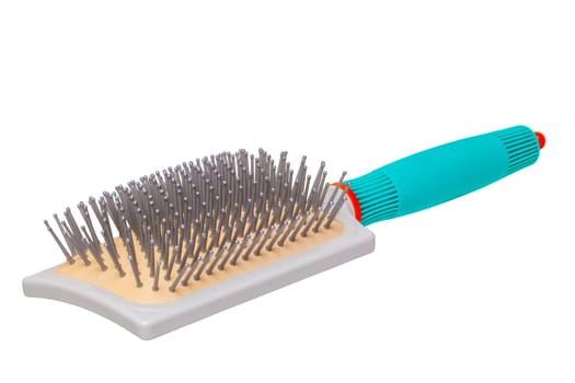 Hairbrush isolated. Closeup of a stylish new green turquoise hair or massage brush or comb isolatedon white. Concept of body and beauty care. Clipping path. Macro.