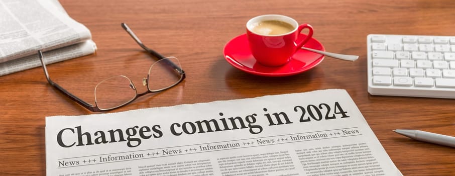 A newspaper on a wooden desk - Changes coming in 2024