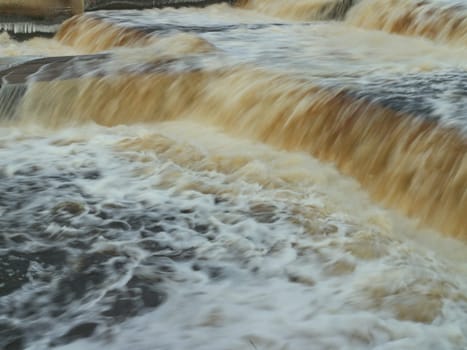 waterfall, rapid stream of seething, foaming white water, long exposure