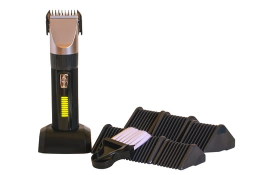 Close-up of a new black silver rechargeable beard and hair clipper with various attachment objects isolated. Clipping path. Cordless hair and beard trimmer. Macro.
