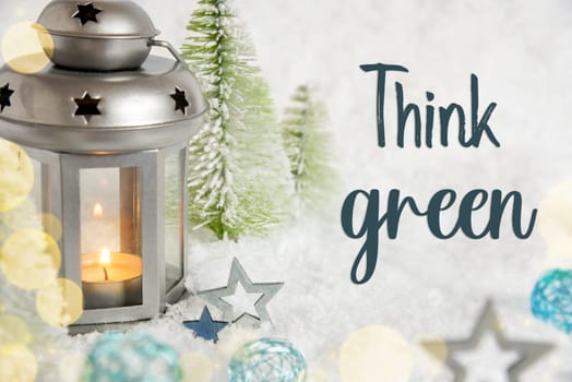 Text Think Green, Christmas Lantern In The Snow, With Winter Decoration, Trees And Stars