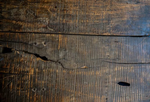 Wooden boards lying next to each other. A wooden texture made from several wooden boards.