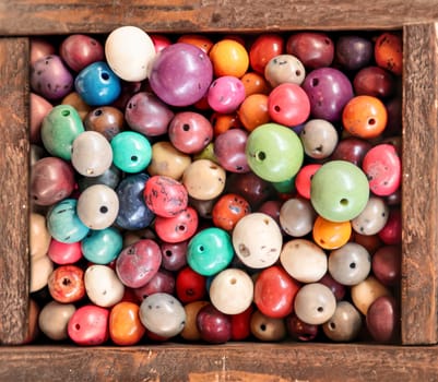 Lots of jewellery beads, beads for a bead necklace in a wooden box.