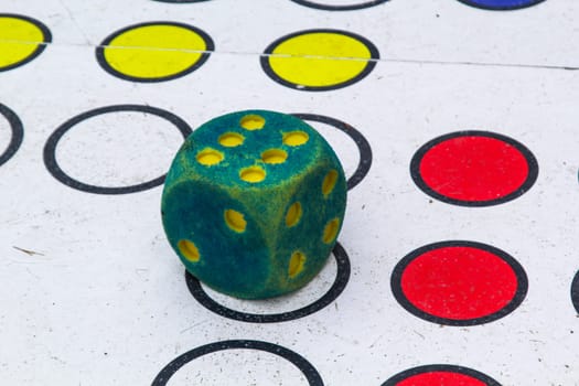 A dice shows the six.