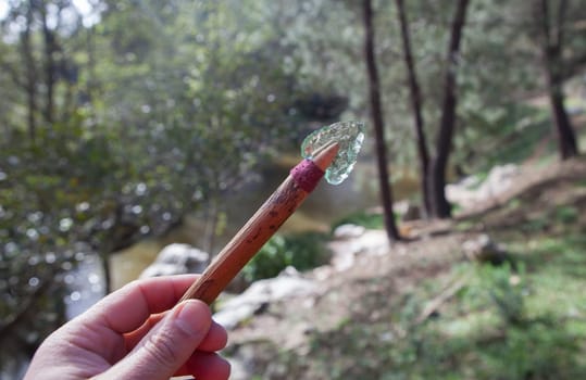 Prehistorical arrowhead built in short shaft. Replica made of glass for educational purposes