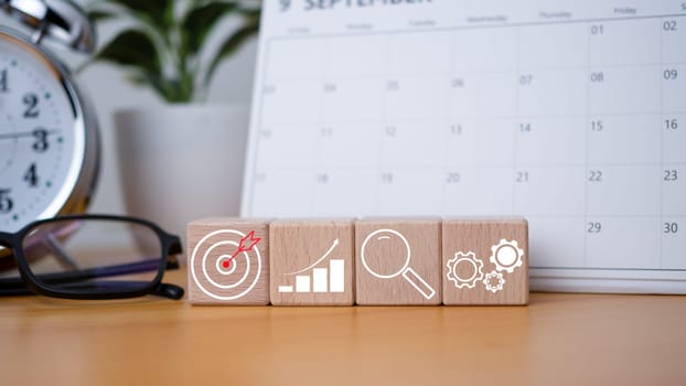Wood cube block stacking with icon. Concept of business strategy and goal action plan.