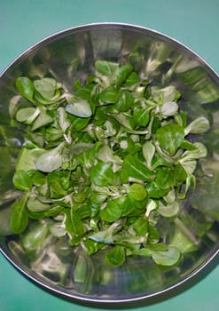 Metallic bowl full of corn salad. Overhead shot