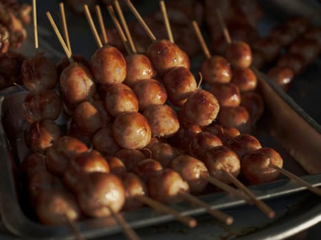 Thai street food in market. Isaan sausages.