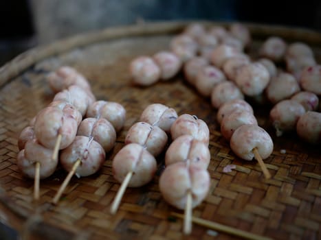 THAI ISAAN SAUSAGE. E-sarn sausages, Homemade sour sausages . Raw homemade pork meat sausages in skins with herbsand spices.