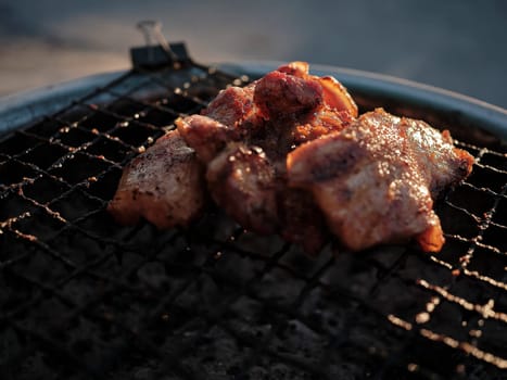 Thai street Food , Pork neck grilled  on the grill .