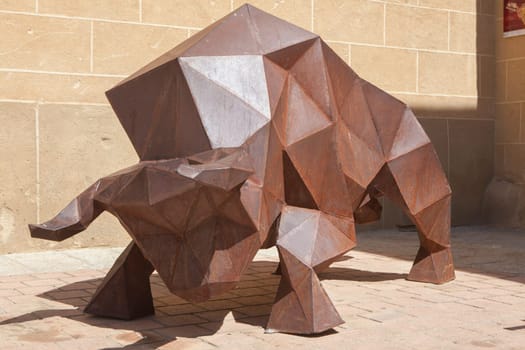 Coria, Spain - Sept 2nd, 2023: Cubist sculpture of bull, Coria, Spain. Unknown artist