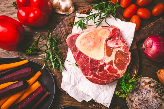 Raw beef meat shank steak, with  ingredients for preparation of ossobuco