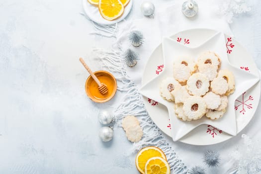 Homemade Christmas cookies with orange and honey.  Christmas decoration with ornaments.