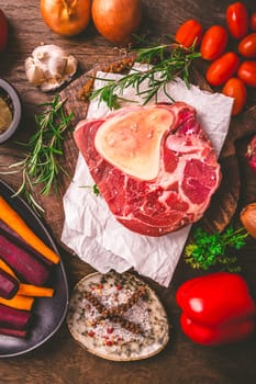 Raw beef meat shank steak, with  ingredients for preparation of ossobuco