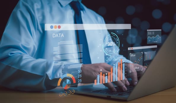 Businessman use computers to analyze business and manage corporate data, business analytics with charts, metrics and KPIs to improve organizational performance, marketing, financial organization strategy.