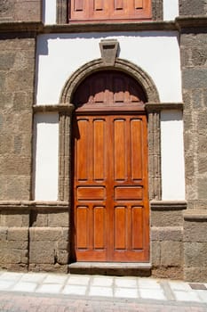 Old wooden door on a house on the Canary Island of Gran Canaria in Spain