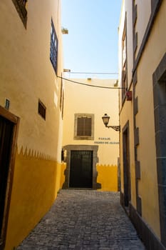 Narrow street with old houses in the historic old town of Las Palmas on the Canary Island of Gran Canaria, Spain, Europe