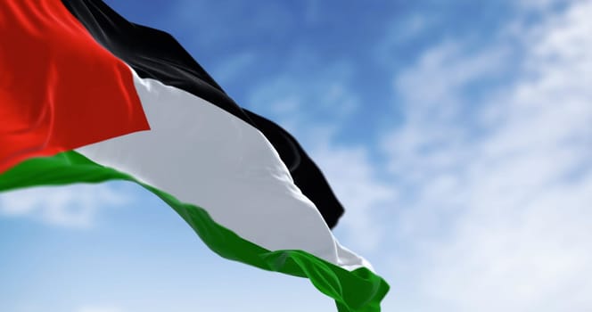 Palestine national flag waving on a clear day. Three black, white, green stripes with red triangle on left. 3d illustration render. Selective focus. Close-up. Rippling fabric