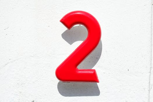 Red Naus license plate number 2 on white background, Germany