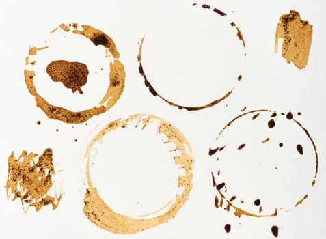 Imprint of spilled black coffee on a white isolated background, set