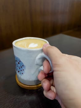 Hot coffee latte with mini heart art , stock photo