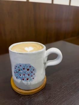 Hot coffee latte with mini heart art , stock photo