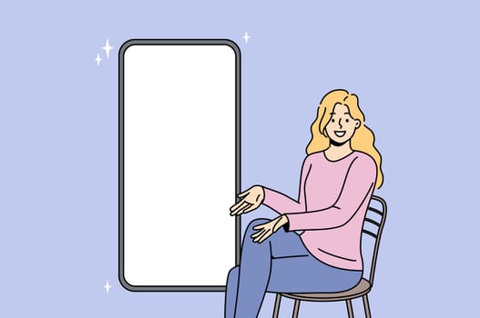 Woman near mock up phone with blank white screen offers to place your advertisement on gadget display. Large phone or smartphone for use in promotional websites and mobile applications