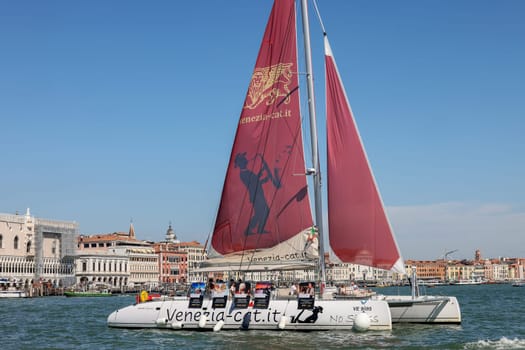 Venice, Italy - September 5, 2022: Catamaran sailing along the San Marco Canal in Venice, Italy