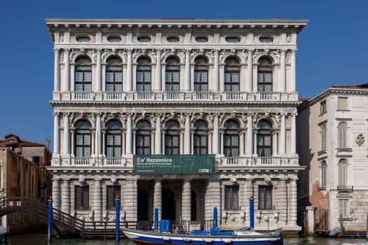 Venice, Italy - September 6, 2022: The white marble facade of Ca' Rezzonico on the Grand Canal in Venice. Italy