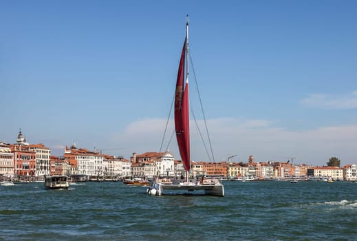 Venice, Italy - September 5, 2022: Catamaran sailing along the San Marco Canal in Venice, Italy