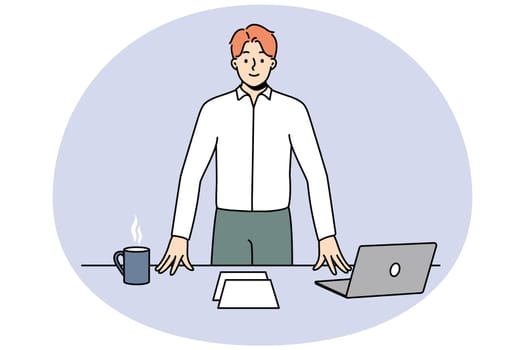 Smiling successful young businessman near office desk with laptop. Happy confident male CEO or boss with computer and coffee on table at workplace. Vector illustration.